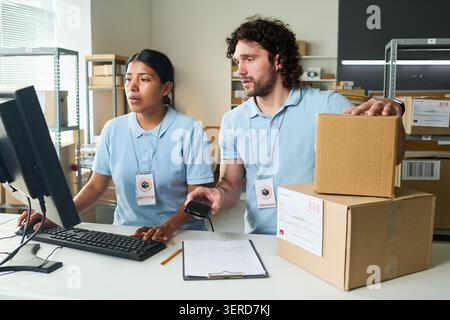 Warehouse Workers Processing Orders at Pickup Point Stock Photo
