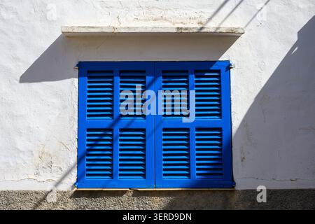 Vibrant blue window shutters, closed Stock Photo