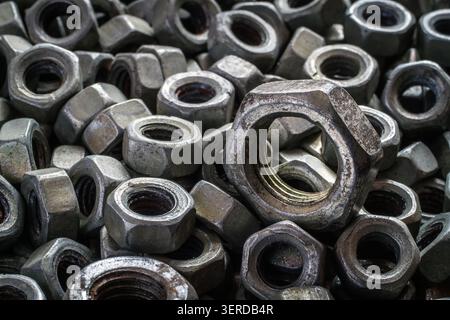 Old iron nuts close-up. Ironmongery. A selective focus. Stock Photo
