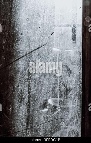 Dirty Dusty Window Glass Texture With Scratches Smudges and Natural Light Stock Photo