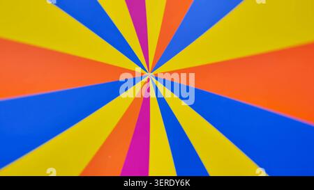Bright rotating multicolored stripes on the wheel. Vibrant Radial Pattern with Bright Color. Stock Photo