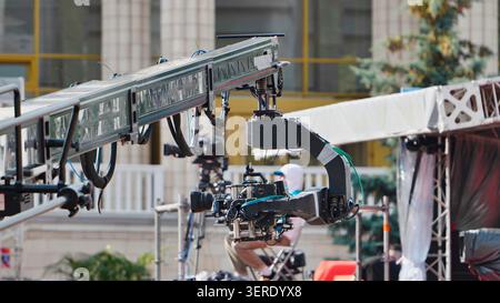Professional video camera mounted on a large jib crane during a production Stock Photo