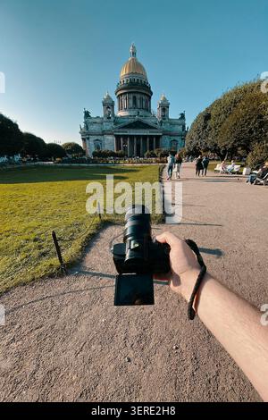 Man takes a picture of a large historic church Stock Photo