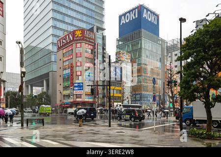 Rainy Chuo-dori street scene beside AOKI and Aisan Electric in Akihabara Electric Town, Tokyo, Japan. Stock Photo