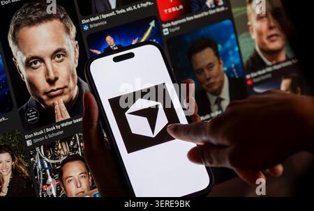 June 18, 2026: In this photo illustration, the Cursor AI logo is displayed on a smartphone screen in front of images of entrepreneur Elon Musk, in New Delhi, India on 18 June 2026. Elon Musk's SpaceX has agreed to acquire AI coding startup Cursor, developed by Anysphere, in a record-breaking all-stock deal valued at Dollar 60 billion. (Credit Image: © David Talukdar/ZUMA Press Wire) EDITORIAL USAGE ONLY! Not for Commercial USAGE! Stock Photo
