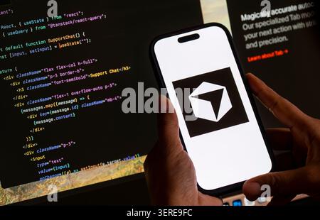 June 18, 2026: In this photo illustration, the Cursor AI logo is displayed on a smartphone screen in front of computer code and software development interface, in New Delhi, India on 18 June 2026. Elon Musk's SpaceX has agreed to acquire AI coding startup Cursor, developed by Anysphere, in a record-breaking all-stock deal valued at Dollar 60 billion. (Credit Image: © David Talukdar/ZUMA Press Wire) EDITORIAL USAGE ONLY! Not for Commercial USAGE! Stock Photo