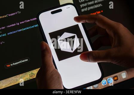 June 18, 2026: In this photo illustration, the Cursor AI logo is displayed on a smartphone screen in front of computer code and software development interface, in New Delhi, India on 18 June 2026. Elon Musk's SpaceX has agreed to acquire AI coding startup Cursor, developed by Anysphere, in a record-breaking all-stock deal valued at Dollar 60 billion. (Credit Image: © David Talukdar/ZUMA Press Wire) EDITORIAL USAGE ONLY! Not for Commercial USAGE! Stock Photo