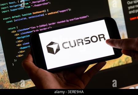 June 18, 2026: In this photo illustration, the Cursor AI logo is displayed on a smartphone screen in front of computer code and software development interface, in New Delhi, India on 18 June 2026. Elon Musk's SpaceX has agreed to acquire AI coding startup Cursor, developed by Anysphere, in a record-breaking all-stock deal valued at Dollar 60 billion. (Credit Image: © David Talukdar/ZUMA Press Wire) EDITORIAL USAGE ONLY! Not for Commercial USAGE! Stock Photo