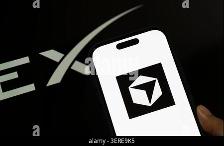 June 18, 2026: In this photo illustration, the SpaceX logo is displayed in the background while the Cursor AI logo appears on a smartphone screen, in New Delhi, India on 18 June 2026. Elon Musk's SpaceX has agreed to acquire AI coding startup Cursor, developed by Anysphere, in a record-breaking all-stock deal valued at Dollar 60 billion. (Credit Image: © David Talukdar/ZUMA Press Wire) EDITORIAL USAGE ONLY! Not for Commercial USAGE! Stock Photo