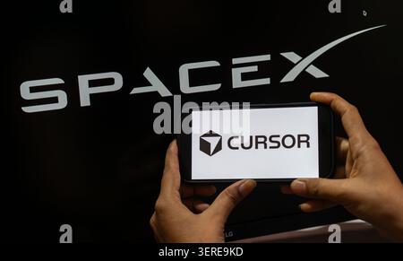June 18, 2026: In this photo illustration, the SpaceX logo is displayed in the background while the Cursor AI logo appears on a smartphone screen, in New Delhi, India on 18 June 2026. Elon Musk's SpaceX has agreed to acquire AI coding startup Cursor, developed by Anysphere, in a record-breaking all-stock deal valued at Dollar 60 billion. (Credit Image: © David Talukdar/ZUMA Press Wire) EDITORIAL USAGE ONLY! Not for Commercial USAGE! Stock Photo