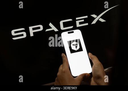 June 18, 2026: In this photo illustration, the SpaceX logo is displayed in the background while the Cursor AI logo appears on a smartphone screen, in New Delhi, India on 18 June 2026. Elon Musk's SpaceX has agreed to acquire AI coding startup Cursor, developed by Anysphere, in a record-breaking all-stock deal valued at Dollar 60 billion. (Credit Image: © David Talukdar/ZUMA Press Wire) EDITORIAL USAGE ONLY! Not for Commercial USAGE! Stock Photo
