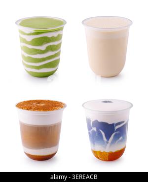 Assorted cold coffee and matcha beverages are presented on white background. Set of takeaway layered drinks includes milk foam and cinnamon powder. Stock Photo