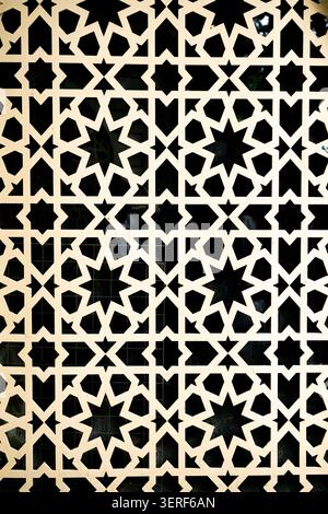 An elegant geometric star lattice pattern background with a black and white cutout contrast. Concept: Modern decorative design and abstract frameworks Stock Photo