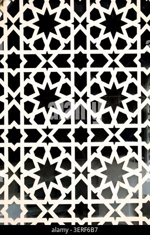 An elegant geometric star lattice pattern background with a black and white cutout contrast. Concept: Modern decorative design and abstract frameworks Stock Photo