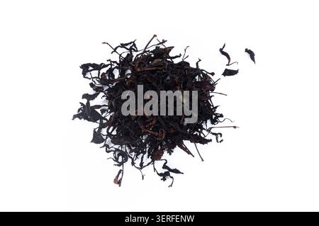 Dried tea leaves isolated on a clean white background, suitable for herbal drink, beverage ingredient Stock Photo
