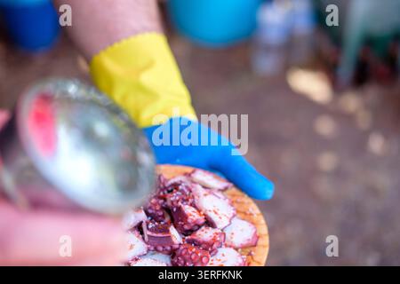 Sprinkling spices on fresh seafood The Concept of traditional cooking Stock Photo
