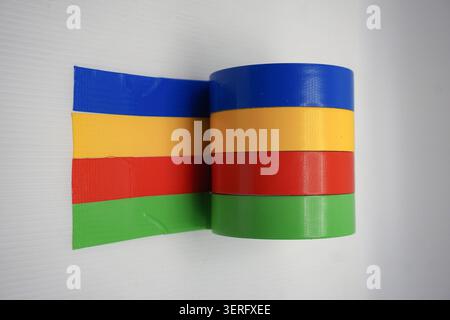 Creative office and craft concept featuring multi-colored sticky tape rolls isolated on white Stock Photo