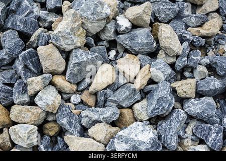 Top view abstract texture of crushed grey and beige gravel stones pile Stock Photo