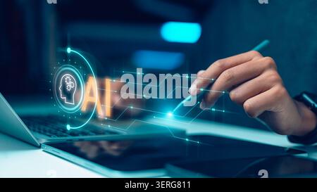 Hand using stylus pen pointing at virtual AI circuit icon on laptop and tablet, concept of artificial intelligence, machine learning, digital transfor Stock Photo
