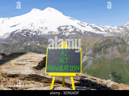 AI act regulation words symbol. Concept words AI artificial intelligence act regulation on beautiful black blackboard. Beautiful mountain background. Stock Photo