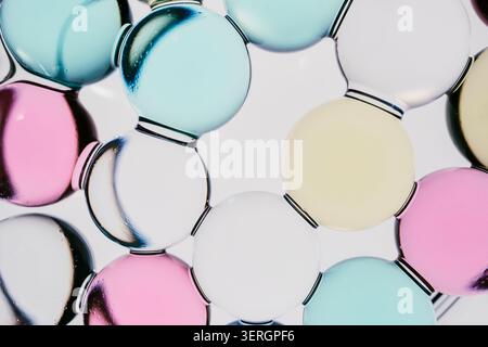 Colorful hydrogel spheres forming abstract network structure Stock Photo