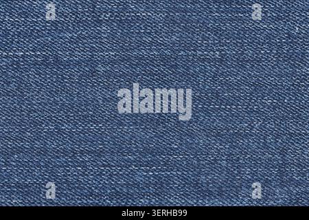 Background texture of classic blue denim jeans structure. Overhead view of indigo cotton textile woven material Stock Photo