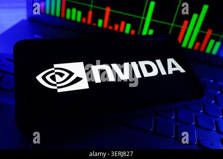 NVIDIA Corporation Graphics Processing Unit Artificial Intelligence Chip Company Logo Displayed On Mobile Phone Screen With Stock Market Chart Backgro Stock Photo
