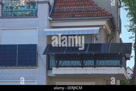 several balcony pv modules delivering practical renewable energy for modern urban living under blue sky Stock Photo
