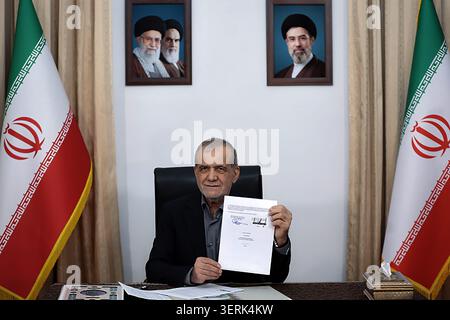 Tehran, Iran. 18th June, 2026. Iran's President Masoud Pezeshkian signing a memorandum of understanding in Tehran on June 18, 2026. US President Donald Trump and Iranian President Masoud Pezeshkian signed a memorandum of understanding early on Thursdy on June 18, ending a regional war that erupted on February 28 with US-Israeli strikes. Photo by Iranian Presidency/UPI Credit: UPI/Alamy Live News Stock Photo