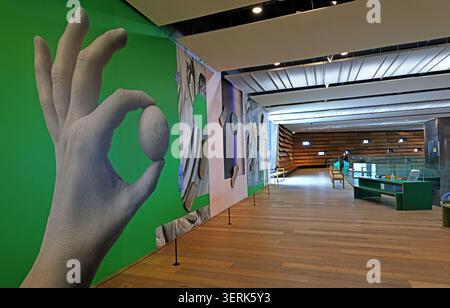 Interior of the Scottish Design Galleries at V&A Dundee, showing bold graphics, display cases and modern museum architecture. Stock Photo