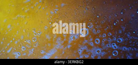 Textured bubbles on yellow-orange liquid. High quality photo Stock Photo