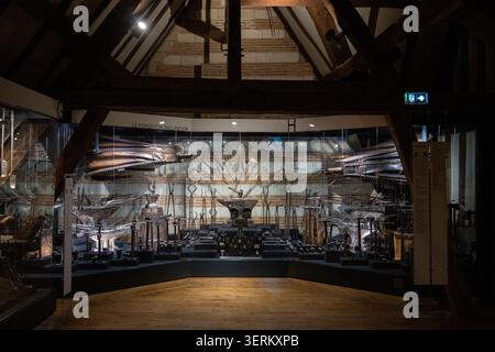 Reims, France - 8 Mar 25: Blacksmith display at Maison de l'Outil museum in Troyes, France, featuring anvils, forging tools, and large bellows behind Stock Photo
