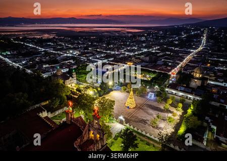 A Christmas tree sits in the plaza of Cuitzeo, Michoacan, Mexico. Stock Photo