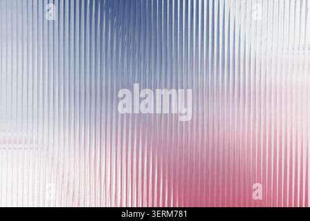 An abstract background featuring a series of vertical lines with a soft, grainy texture and a bold gradient transition from deep blue to vibrant pink. Stock Photo