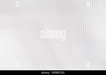 A minimalist abstract background featuring subtle vertical lines with a soft, light grey gradient texture, creating a clean and modern aesthetic. Stock Photo