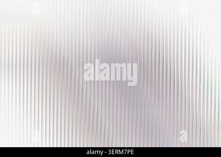 A bright, textured background with vertical ribbed lines and a soft, ethereal light effect, perfect for clean and minimalist design projects. Stock Photo