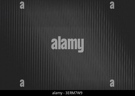A minimalist dark background featuring subtle vertical lines and a fine grainy texture, creating a sophisticated and modern aesthetic. Stock Photo