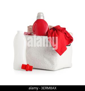 Laundry detergent bottles and fabric softener with clothes in a white basket for household cleaning and washing, the items are isolated on a clean whi Stock Photo