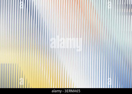 A vibrant abstract background composed of vertical textured lines, blending shades of blue, orange, and yellow in a dynamic, rhythmic light-refracted Stock Photo