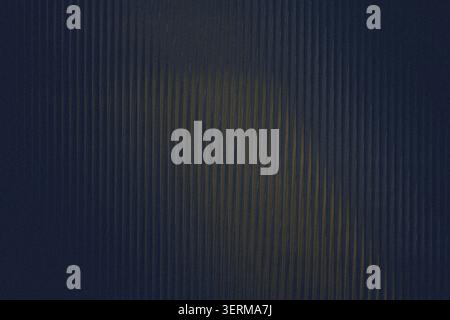 A dark, moody abstract background featuring a pattern of vertical corrugated lines with subtle golden highlights, creating a sophisticated texture. Stock Photo