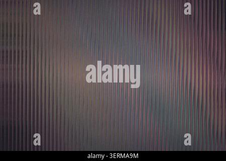 A dark, moody abstract background featuring a pattern of fine vertical lines with a subtle gradient shift from deep purple to muted grey tones. Stock Photo