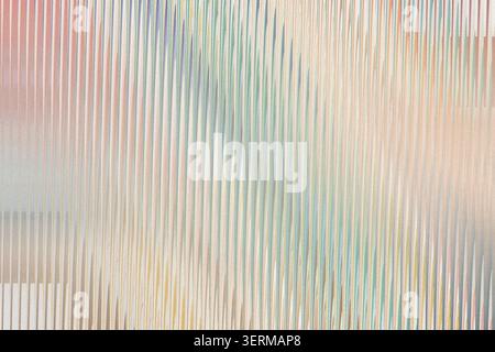 A soft and colorful abstract background featuring a pattern of vertical lines in various pastel hues, blending together for a gentle and artistic look Stock Photo
