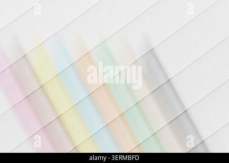 A minimalist abstract background featuring diagonal stripes with a soft, grainy texture and a subtle pastel rainbow gradient transition. Stock Photo