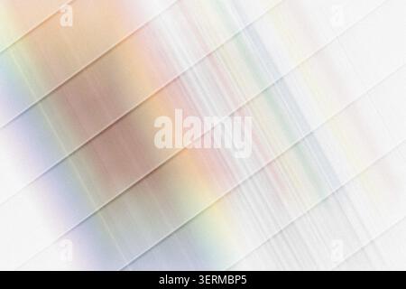 An abstract background featuring diagonal stripes with soft, blurred rainbow-colored light streaks, creating a vibrant and modern aesthetic. Stock Photo