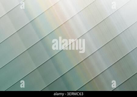 An abstract digital art background featuring parallel diagonal lines overlaid on a muted grey and white gradient with a subtle grainy texture. Stock Photo