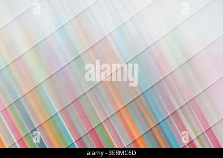 An abstract background featuring diagonal stripes with a vibrant, multi-colored gradient effect, creating a dynamic and energetic visual. Stock Photo