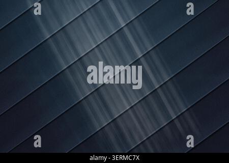 A sophisticated abstract background featuring dark blue diagonal stripes with a subtle metallic, brushed texture and soft light gradients. Stock Photo
