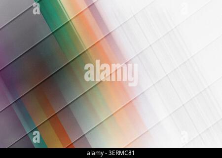 A modern abstract design featuring diagonal parallel lines with a soft, blurred gradient of green, orange, and purple tones on a textured background. Stock Photo