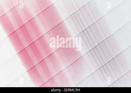 A minimalist abstract background featuring diagonal stripes with a soft red and grey gradient, isolated on a pure white background. Stock Photo