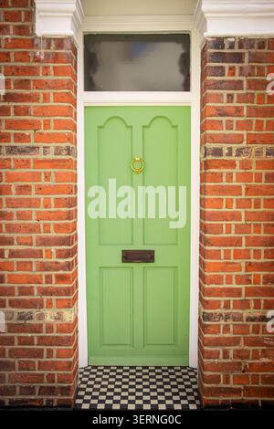 LONDON - green door on red brick period house Stock Photo